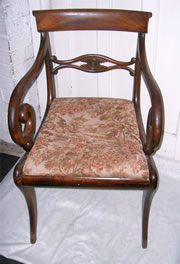 A very good Regency mahogany carver chair with nice cross rail scroll arms drop in seat and sabre front legs