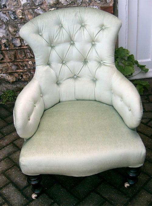 SOLD - A late Victorian buttoned back chair with turned legs