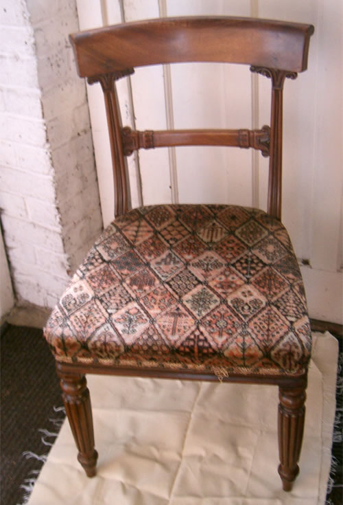 For Sale - A set of 4 golden mahogany late Regency bar back chairs with fluted legs