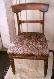 A set of 4 golden mahogany late Regency bar back chairs with fluted legs