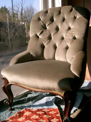 A very good Victorian buttoned back chair with mahogany cabriole legs